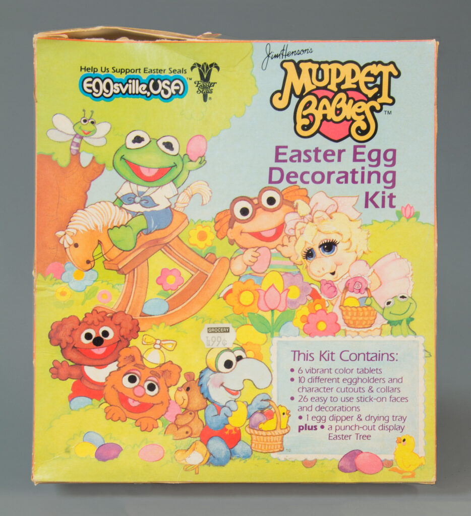 Illustration of  Jim Henson’s Muppet Babies Easter Egg Decorating Kit, 1985, gift of Peggyann Munnick in loving memory of her husband Ken Munnick, The Strong, Rochester, New York.