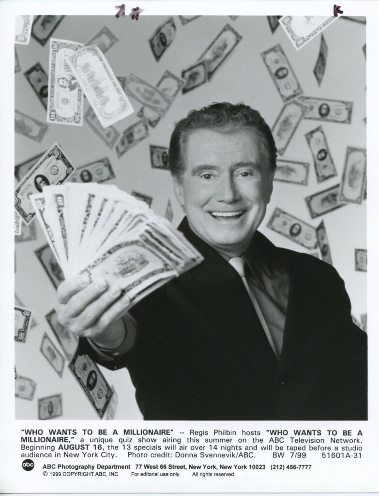 Host Regis Philbin flashing money, though clearly not one million